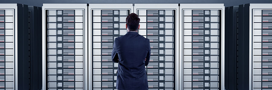 Person standing in front of server towers