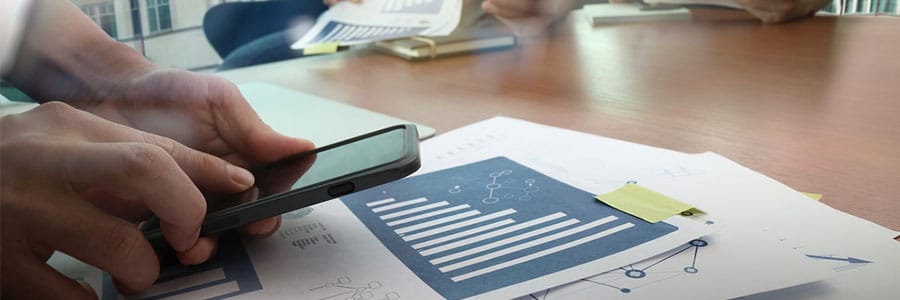 Person taking pictures of a bar chart on their phone