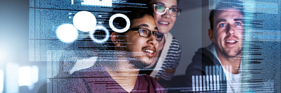 3 people looking at computer screen