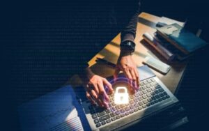 Person typing on computer with a lock above them