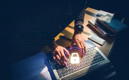 Person typing on computer with a lock above them