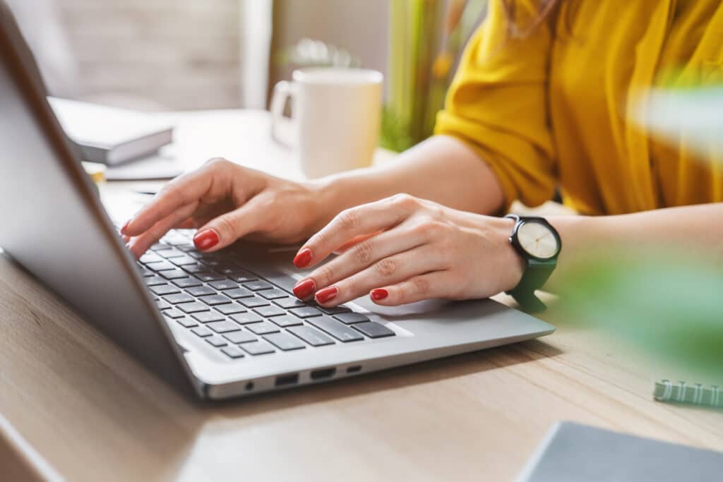 woman updating laptop