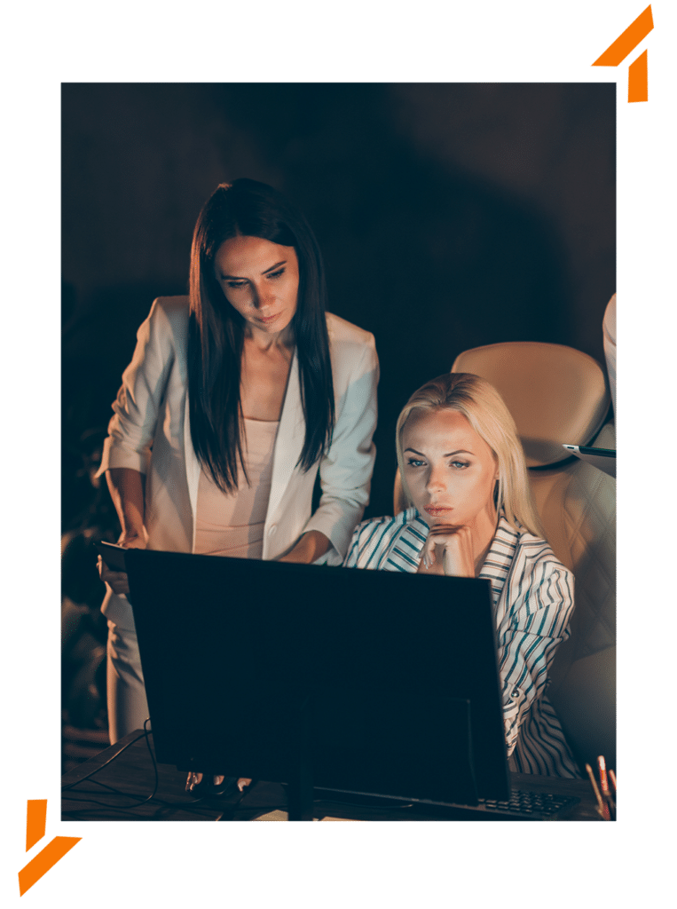 Two Female IT Technicians at desktop