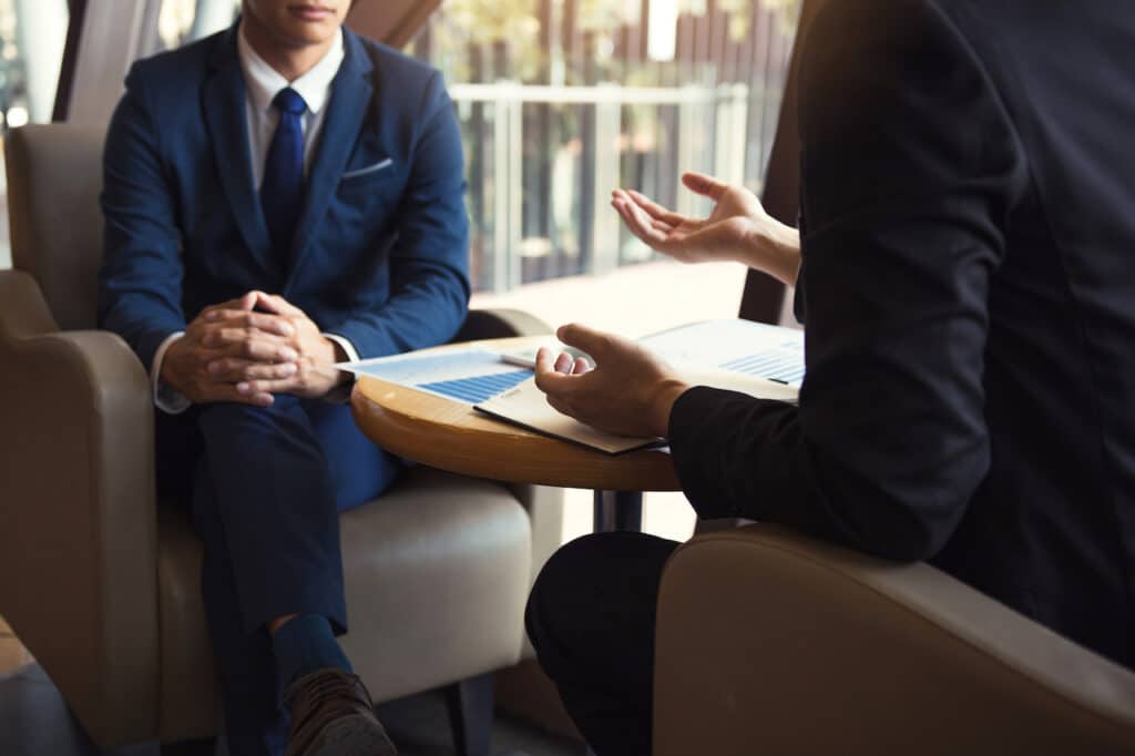 two employees discussing cybersecurity for community banks