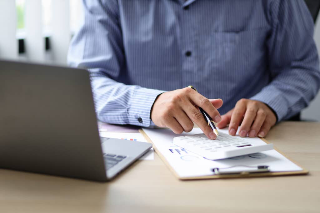 person on laptop utilizing it services for banks