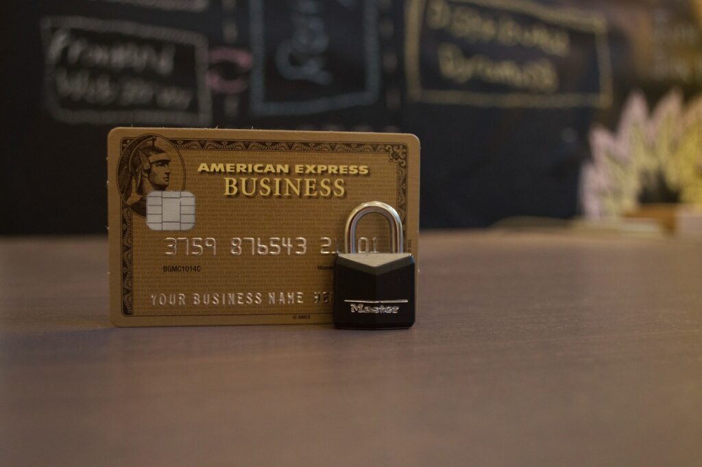 A small lock sits in front of a credit card