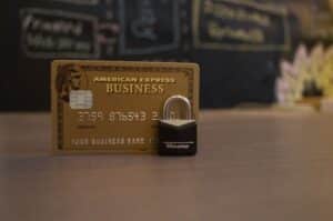 A small lock sits in front of a credit card