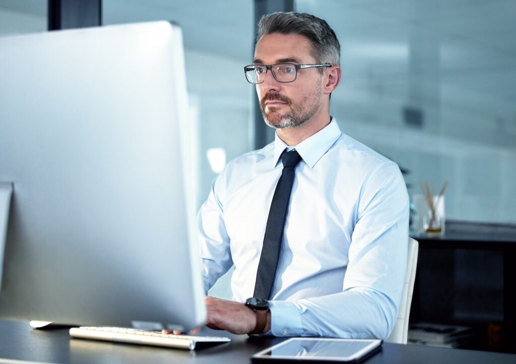 bank employee working on banking compliance