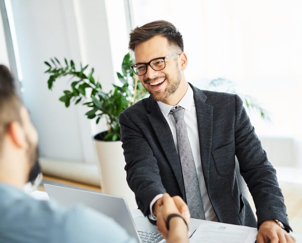 banker working on vendor management by meeting new vendor