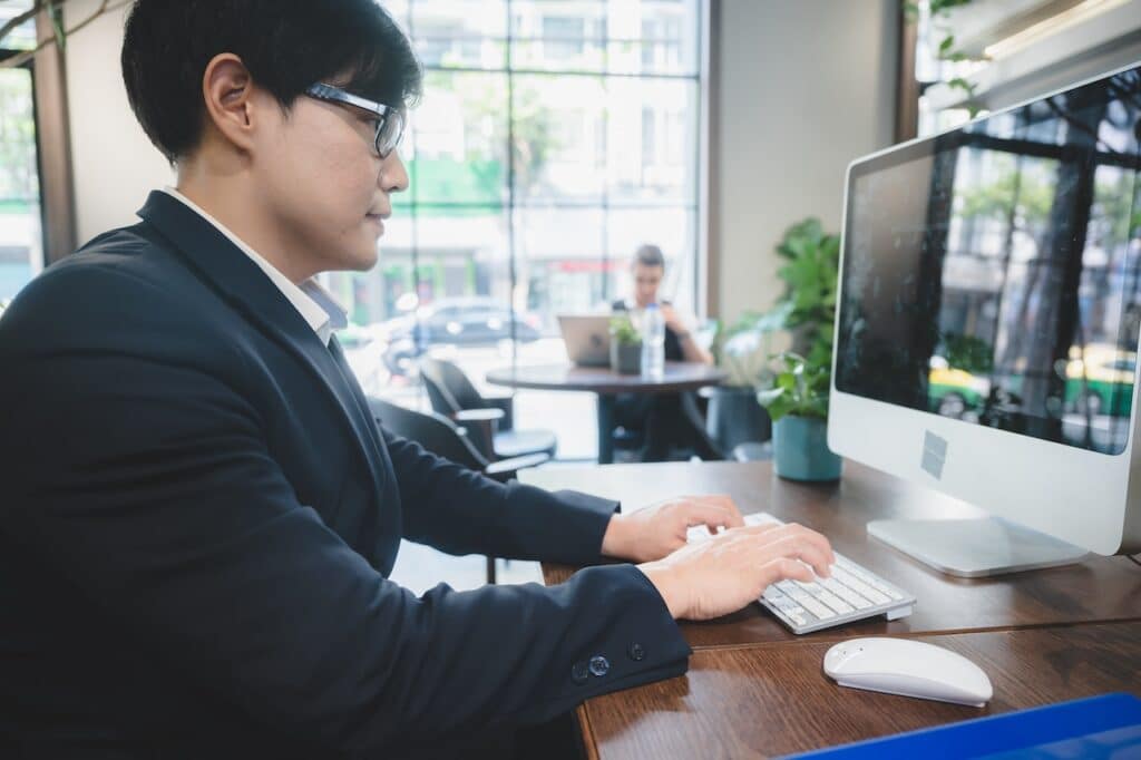 employee working on computer using banking IT services
