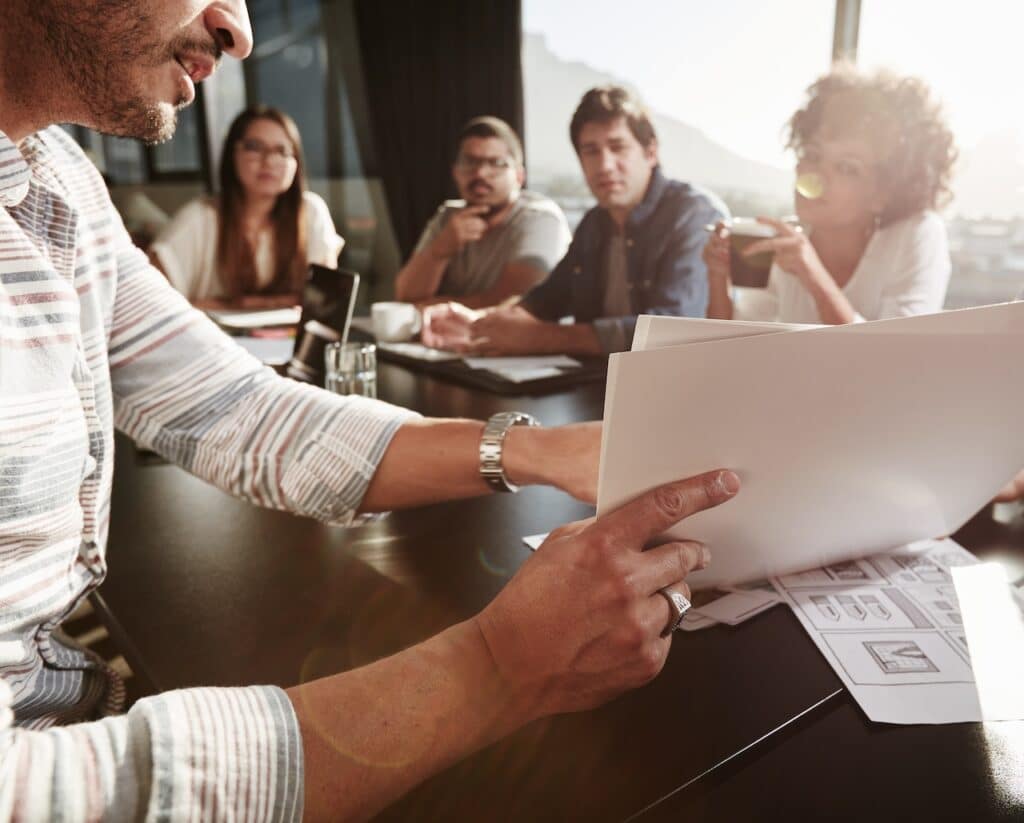employee presenting cybersecurity risk assessment report