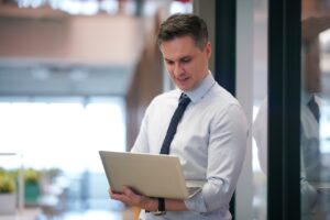 bank employee looking at laptop